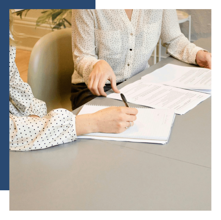 People discussing documents at table