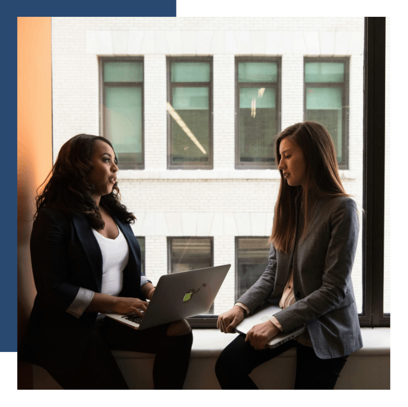 Two women in discussion indoors