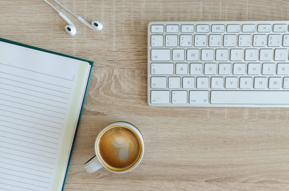 Coffee cup and notebook setup